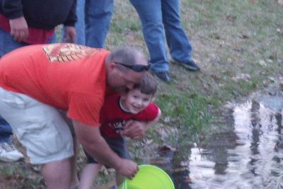 Family Enjoying Pond Stocking